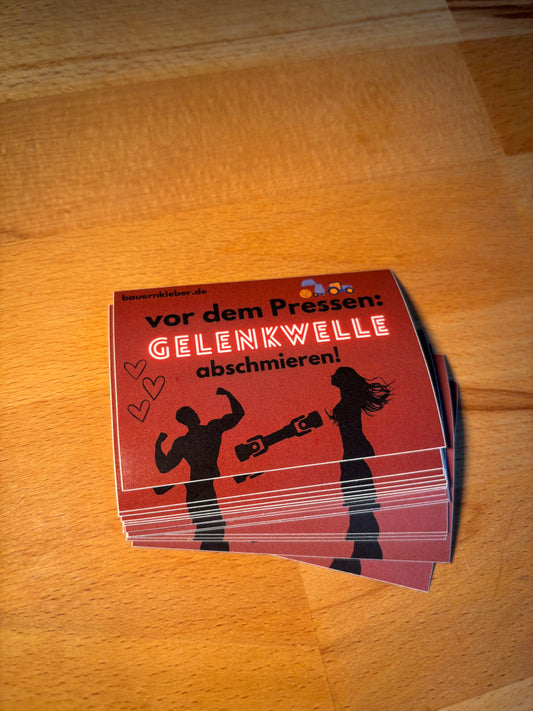 Sticker " Vor dem Pressen Gelenkwelle abschmieren"
